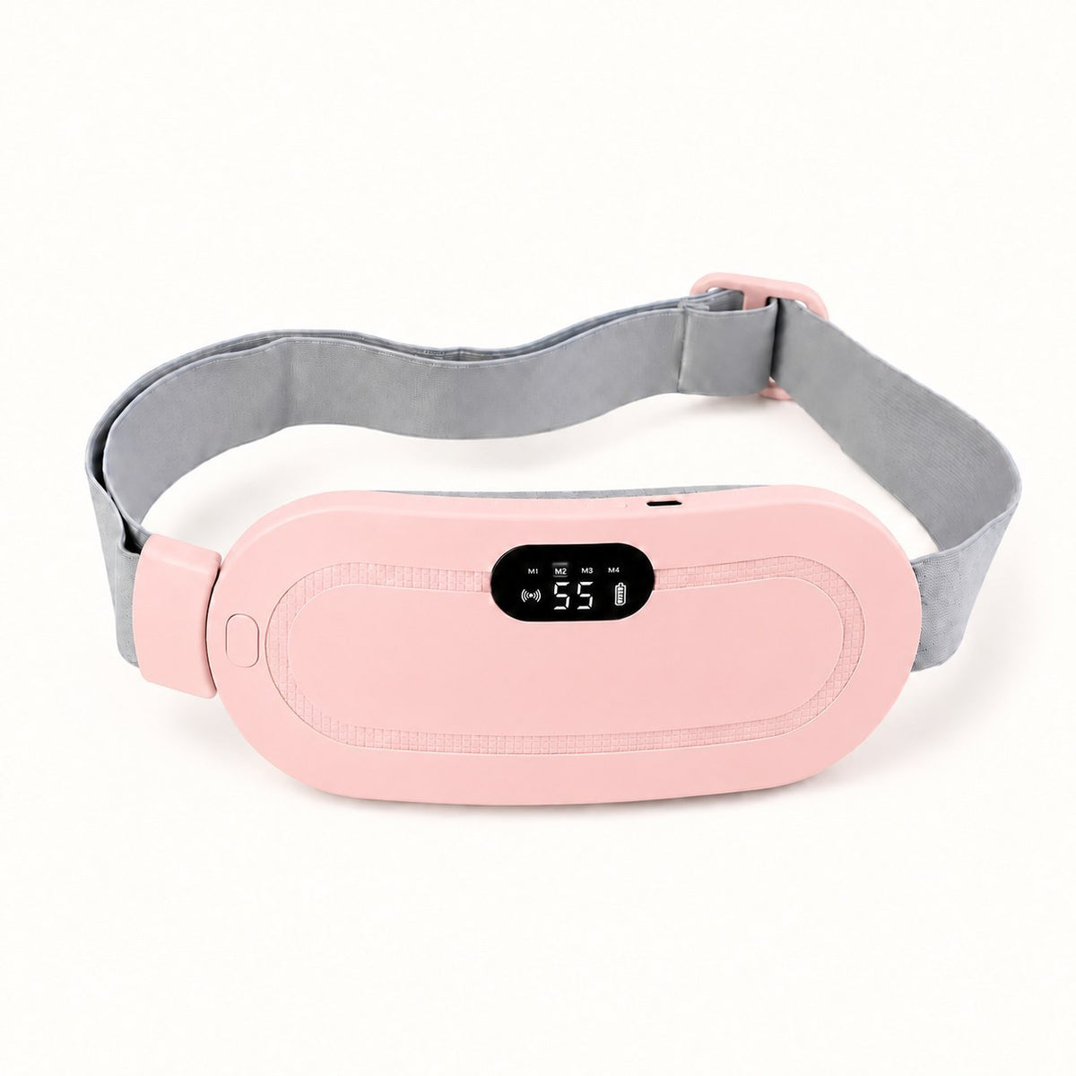 Ceinture chauffante CHALYNE rose posée à plat, sangle grise déployée, écran de réglage allumé