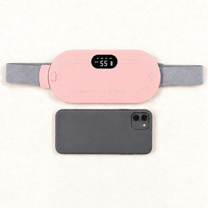Ceinture chauffante CHALYNE rose comparée à un smartphone pour montrer sa taille réelle